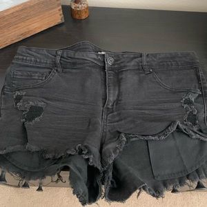 Gently used, distressed black jean shorts, size 14